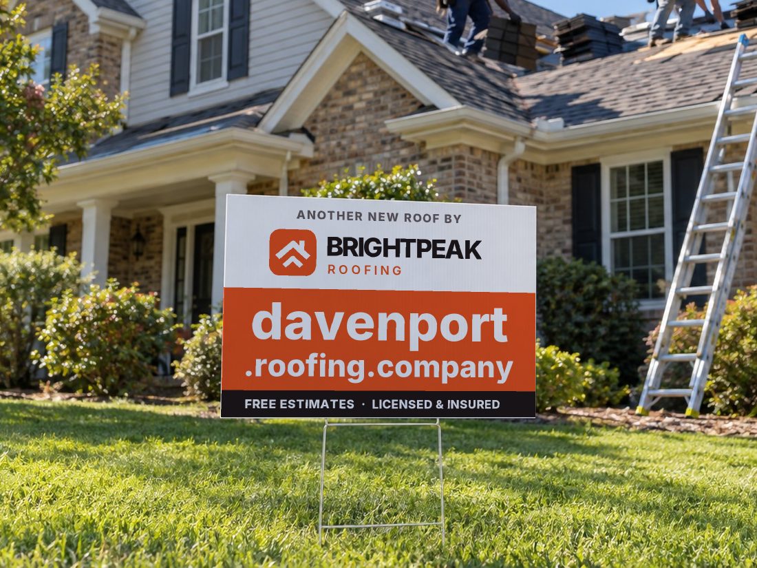 davenport.roofing.company on a yard sign in front of a house getting a new roof